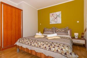 Postel nebo postele na pokoji v ubytování Apartmani Jasminka