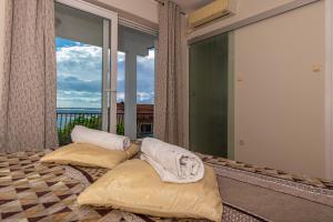 Postel nebo postele na pokoji v ubytování Apartmani Jasminka