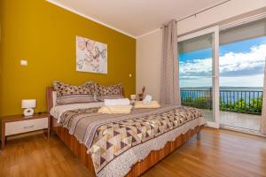 Postel nebo postele na pokoji v ubytování Apartmani Jasminka