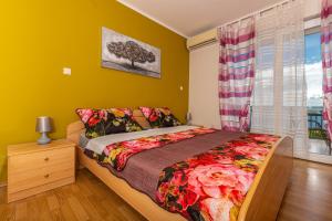 Postel nebo postele na pokoji v ubytování Apartmani Jasminka