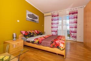 Postel nebo postele na pokoji v ubytování Apartmani Jasminka