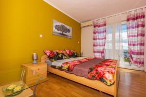 Postel nebo postele na pokoji v ubytování Apartmani Jasminka