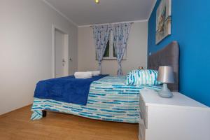 Postel nebo postele na pokoji v ubytování Apartmani Jasminka
