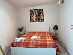 Postel nebo postele na pokoji v ubytování Casa Renato