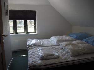 Postel nebo postele na pokoji v ubytování Blåvandshuk Golf Hostel