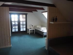 Postel nebo postele na pokoji v ubytování Blåvandshuk Golf Hostel