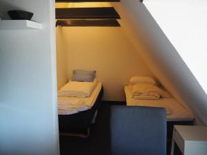 Postel nebo postele na pokoji v ubytování Blåvandshuk Golf Hostel