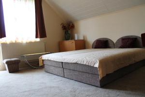 Postel nebo postele na pokoji v ubytování Ibolya Apartmanok