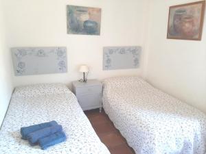 Łóżko lub łóżka w pokoju w obiekcie Casa Rural La Aulaga