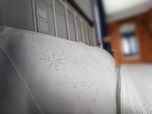 Postel nebo postele na pokoji v ubytování Samia Seavilla Pythagorio