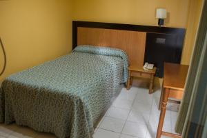 Posteľ alebo postele v izbe v ubytovaní Hostal La Palmera
