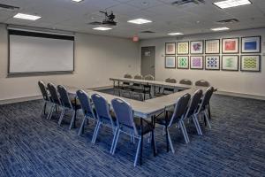 a conference room with a long table and chairs at Holiday Inn Express Hotel & Suites Smyrna-Nashville Area by IHG in Smyrna