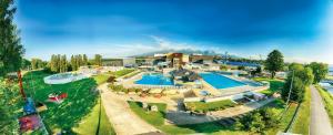 an aerial view of a resort with a swimming pool at Hotel AquaCity Seasons in Poprad