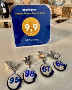 a group of charms with the number on them at B&B Shining in Avola