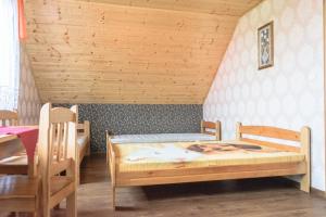Postel nebo postele na pokoji v ubytování Wzgórze Baranów