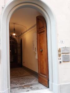 
a doorway leading to a room with a door open at Residenza d'Epoca Palazzo Riblet in Florence
