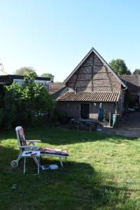 A garden outside Aan de Holle Weg. Zeer landelijk gelegen verbouwde stal tot woning