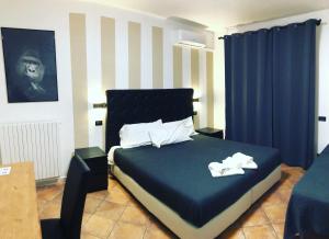Posteľ alebo postele v izbe v ubytovaní B&B Il Viaggiatore
