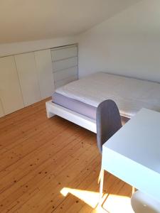 Ein Bett oder Betten in einem Zimmer der Unterkunft Ferienhaus Schreinerei Adenauer