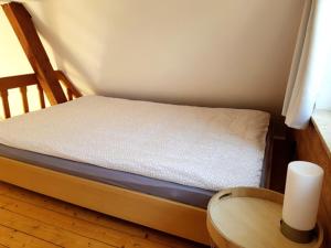 Ein Bett oder Betten in einem Zimmer der Unterkunft Ferienhaus Schreinerei Adenauer