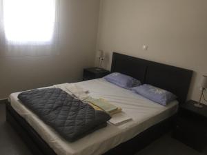 A bed or beds in a room at Cycladic houses in rural surrounding