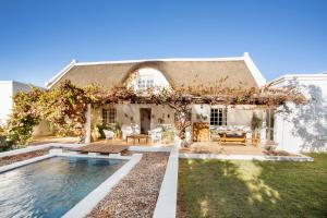 a house with a swimming pool in the yard at The Grand Marigold in McGregor