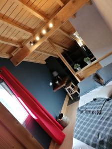 an overhead view of a room with a bed and a loft at Le petit coin de Jeanne et Marcel chalet de vacances La Bresse in La Bresse