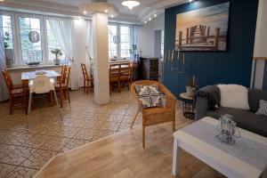 a living room with a couch and a table at Koga in Ustka +53 photos