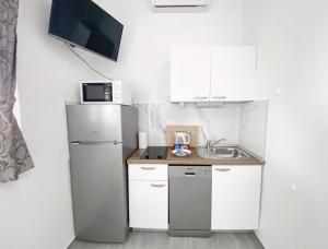 Kuchyň nebo kuchyňský kout v ubytování Apartmani Daša Tučepi + 37 fotografií