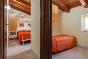 Кровать или кровати в номере Agriturismo Zefiro