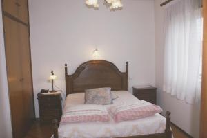 En eller flere senger på et rom på Hotel Primavera