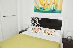 En eller flere senge i et værelse på Apartamento Adriana. Céntrico, a 50m de la playa.
