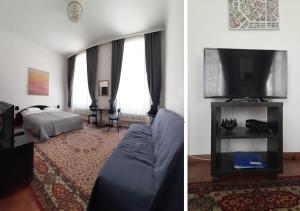 ein Wohnzimmer mit einem Bett und einem Flachbild-TV in der Unterkunft Pension Lerner in Wien