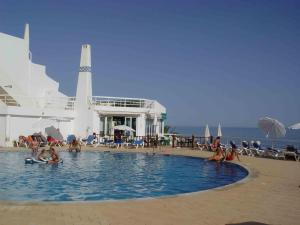 a group of people in a swimming pool on a cruise ship at Oura Ocean Front in Albufeira