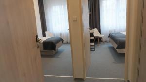 Postel nebo postele na pokoji v ubytování Hotel Metropol CB