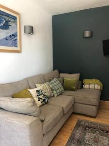 a living room with a couch in a room at Fox Cottage in Moffat