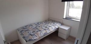 Postel nebo postele na pokoji v ubytování Appartement Duplex à l'entrée de Ciney Avec emplacement vélos