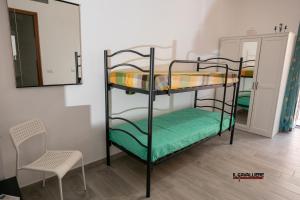 Il Cavalliere Bed & breakfast emeletes ágyai egy szobában