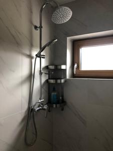 a shower in a bathroom with a shower head at CASA SMIDA JAZZ in Smida