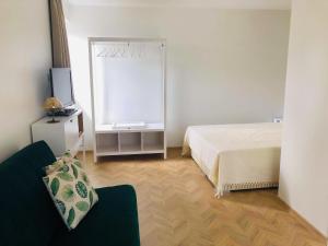 Postel nebo postele na pokoji v ubytování Kulautuva Park Apartments