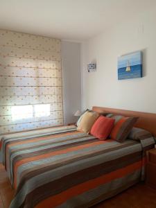 Postel nebo postele na pokoji v ubytování Apartamento en Torre Valentina, la mejor playa a dos minutos en San Antonio de Calonge