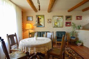 a dining room with a table and chairs at Flower Street in Svityazʼ