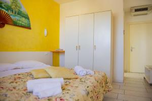 Postel nebo postele na pokoji v ubytování Hotel del Sole