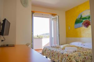 Postel nebo postele na pokoji v ubytování Hotel del Sole