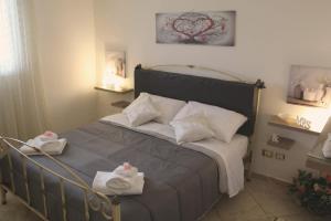 Posteľ alebo postele v izbe v ubytovaní CupidoHouse a Mondello