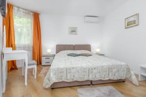 Ein Bett oder Betten in einem Zimmer der Unterkunft Apartman POREČ CENTER SEA