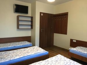 Postel nebo postele na pokoji v ubytování ANNA NOCLEGI