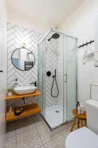 a bathroom with a shower and a sink at Penzion Mácha in Litoměřice