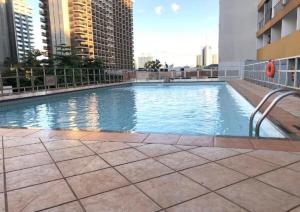 a large swimming pool on top of a building at Sian Apart Hotel Garvey in Brasília