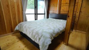 A bed or beds in a room at Mannaya -SEVEN Hotels and Resorts-